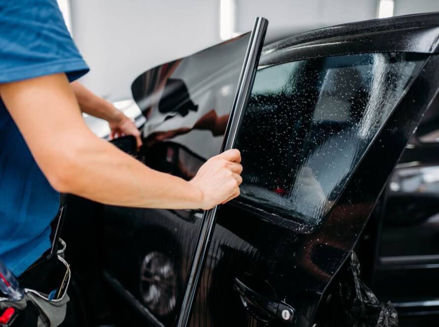 Aging car wrap showing peeling edges — signs it's time to replace your vehicle wrap