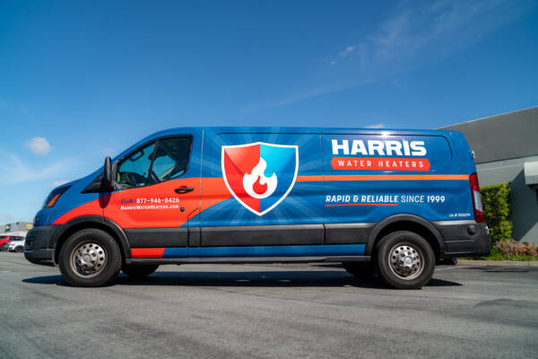 Harris Water Heaters branded blue service van wrap for water heater repair and installation